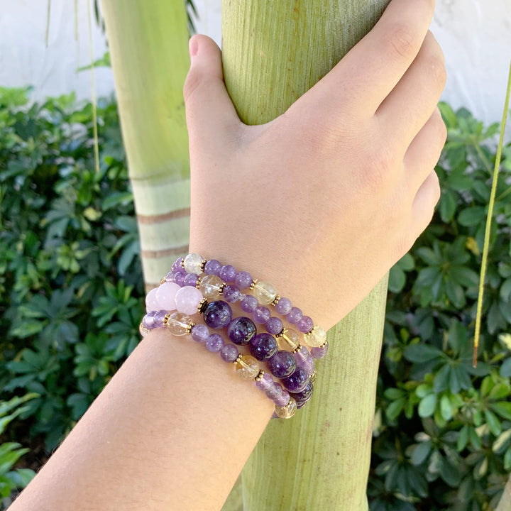 amethyst citrine bracelet in a hand