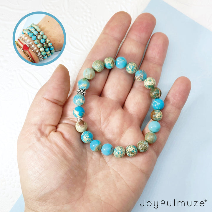 Turquoise Emperor Jasper Silver Bracelet in hand