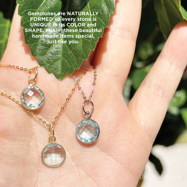 3 london blue topaz necklaces in hand